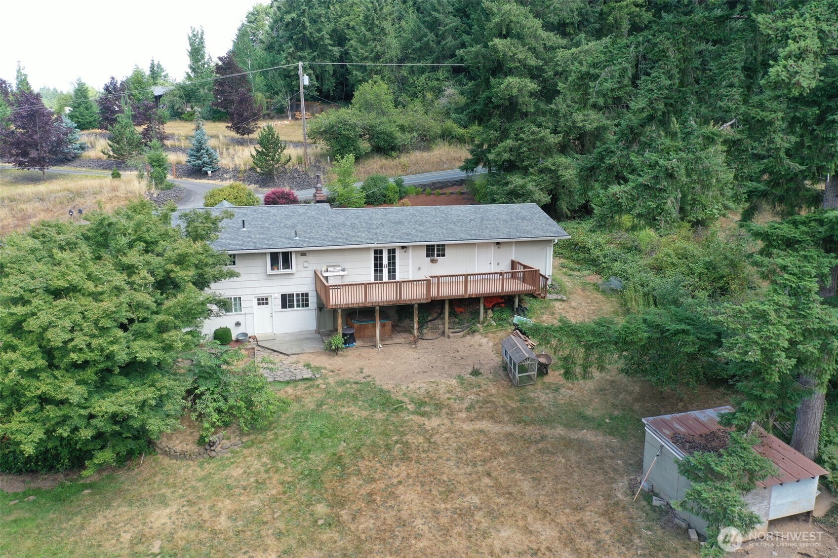 523 Haywire Road Winlock, WA 98596 - Photo 36 of 40 an aerial view of a house with a yard and lake view