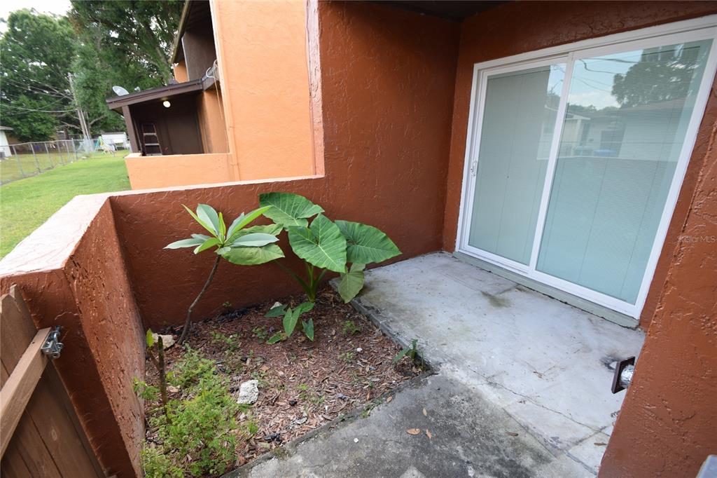 945 Castle Way, Unit 945 Lakeland, FL 33803 - Photo 15 of 16 a view of a backyard with a garden