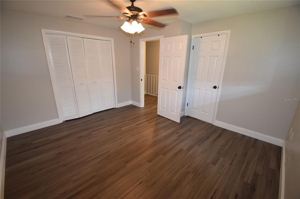 945 Castle Way, Unit 945 Lakeland, FL 33803 - Photo 10 of 16 wooden floor in an empty room