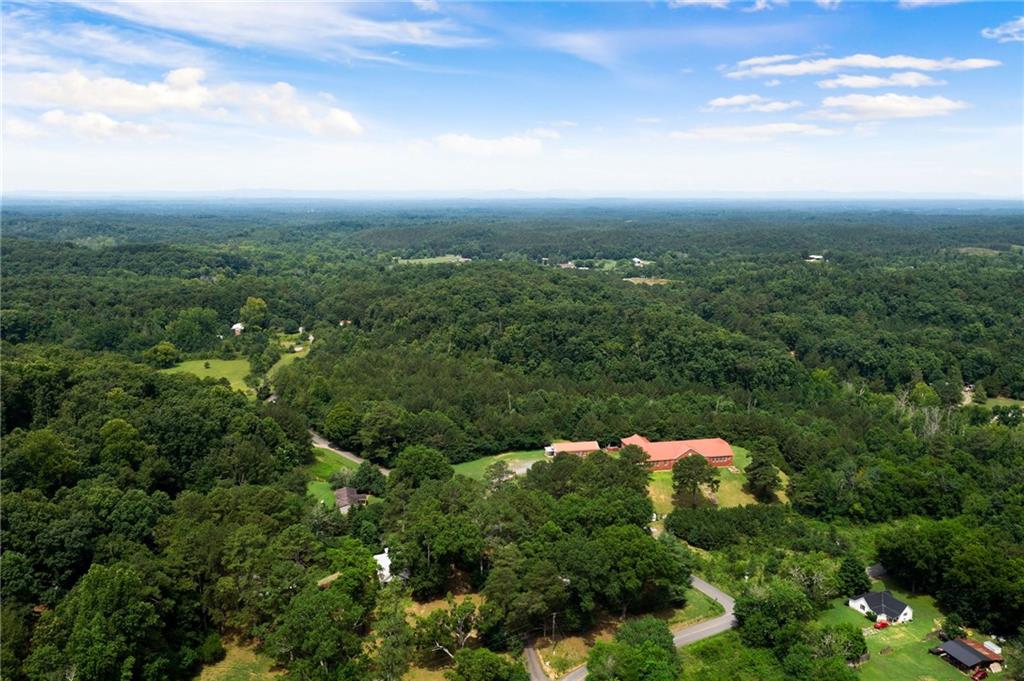 0 Hanes Road Northeast Ranger, GA 30734 - Photo 1 of 1 an aerial view of house with yard and mountain view in back