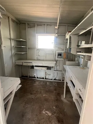 a kitchen with stainless steel appliances granite countertop a sink and a stove