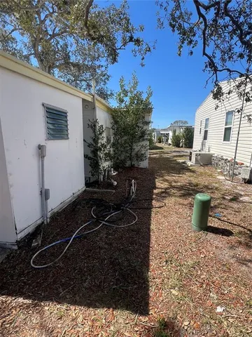 a view of a backyard with sitting area