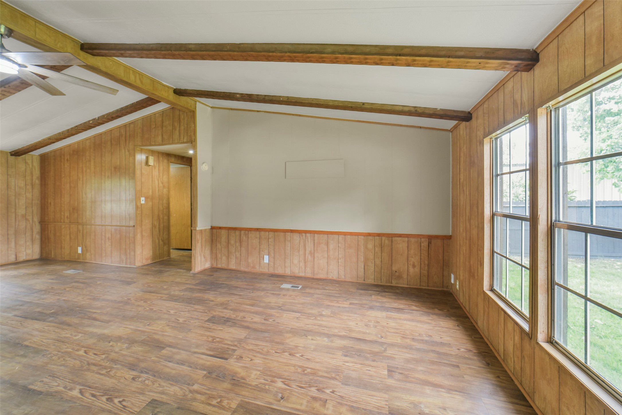 11023 Forrest Valley Drive Houston, TX 77065 - Photo 6 of 47 a view of empty room with wooden floor and fan