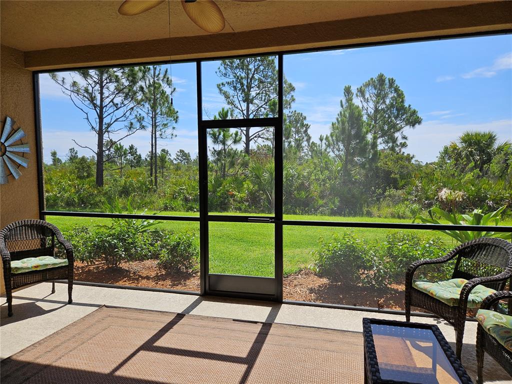 10039 Crooked Creek Drive, Unit 102 Venice, FL 34293 - Photo 19 of 36 a view of a balcony with chairs