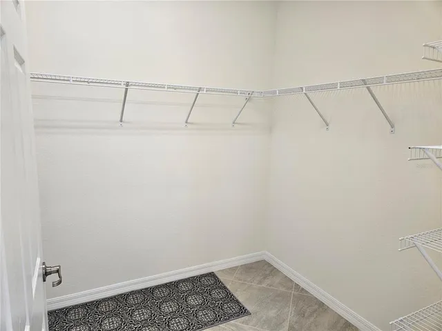 a view of a hallway with closet area