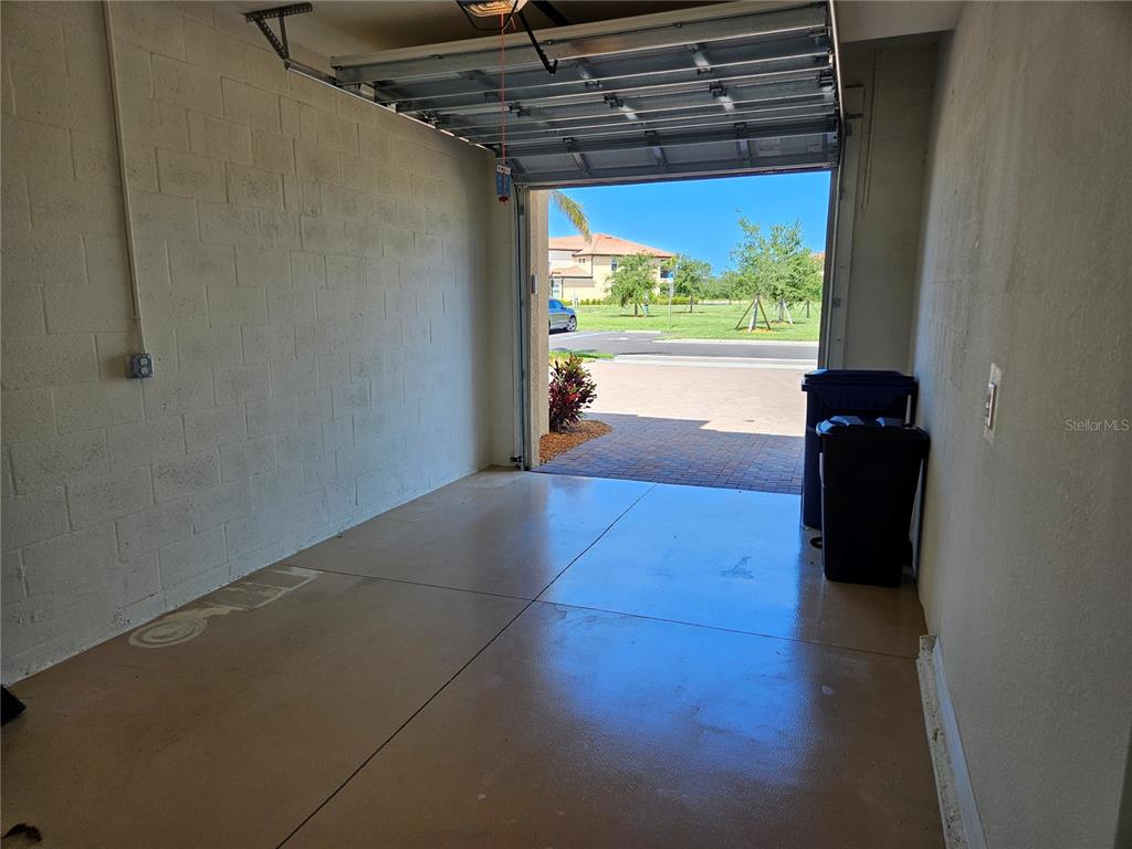 10039 Crooked Creek Drive, Unit 102 Venice, FL 34293 - Photo 36 of 36 a view of a glass door with a hallway