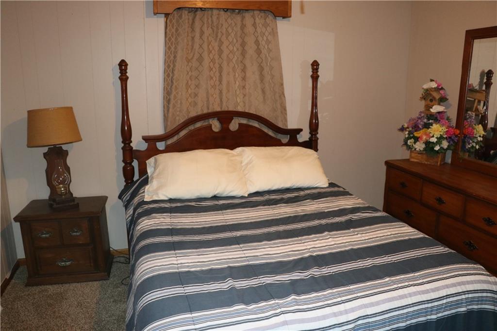 463 Compton Road Silver Creek, GA 30173 - Photo 6 of 12 a bedroom with a bed and a potted plant