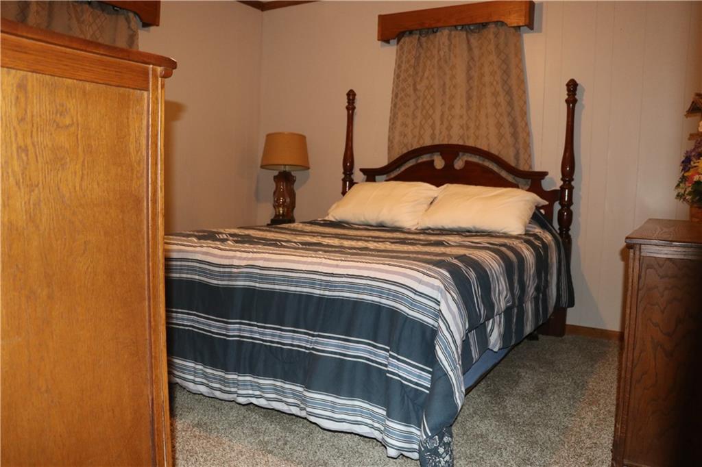 463 Compton Road Silver Creek, GA 30173 - Photo 7 of 12 a bedroom with a bed and a cabinet