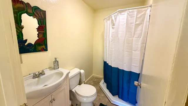 a workspace with wooden floor and a window