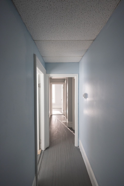 10 Sycamore Street, Unit 2 Worcester, MA 01608 - Photo 5 of 11 a view of a hallway with wooden floor