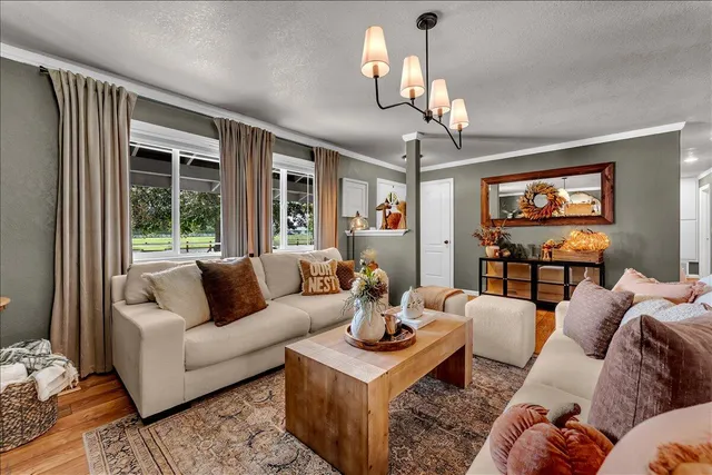 a living room with furniture and a flat screen tv