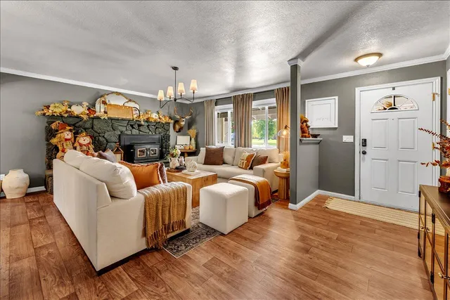 a living room with furniture ceiling fan and a window