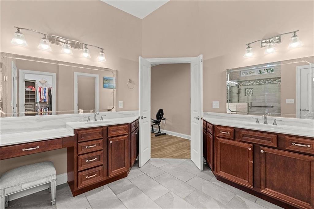 5320 North Helton Road Winston, GA 30187 - Photo 14 of 54 a spacious bathroom with a granite countertop sink and a mirror