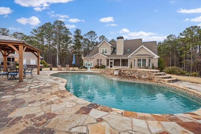 5320 North Helton Road Winston, GA 30187 - Photo 16 of 54 a view of a lake with a house