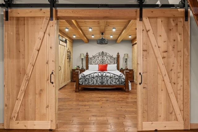 5320 North Helton Road Winston, GA 30187 - Photo 29 of 54 a bedroom with a bed and a wooden floor