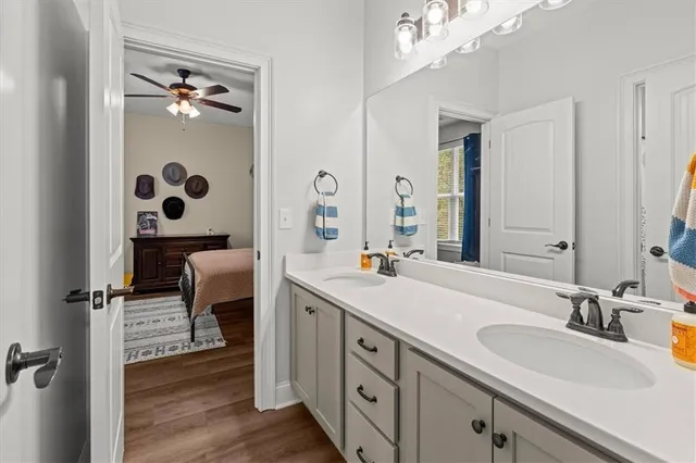 a view of a water pond with green yard