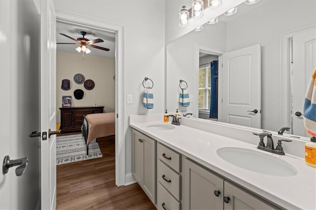 5320 North Helton Road Winston, GA 30187 - Photo 49 of 54 a spacious bathroom with a double vanity sink a mirror and a shower