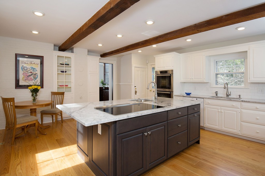 17 Lee Road Newton, MA 02467 - Photo 3 of 11 a open kitchen with stainless steel appliances granite countertop a sink dishwasher a stove and a refrigerator with wooden floor