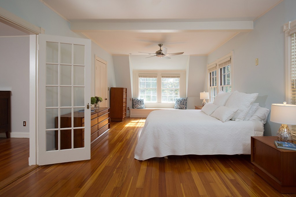 17 Lee Road Newton, MA 02467 - Photo 8 of 11 a spacious bedroom with a bed and wooden floor