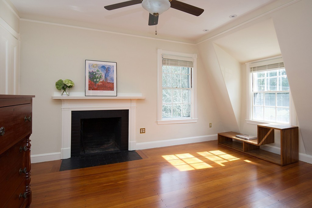 17 Lee Road Newton, MA 02467 - Photo 10 of 11 a living room with a fireplace and a window