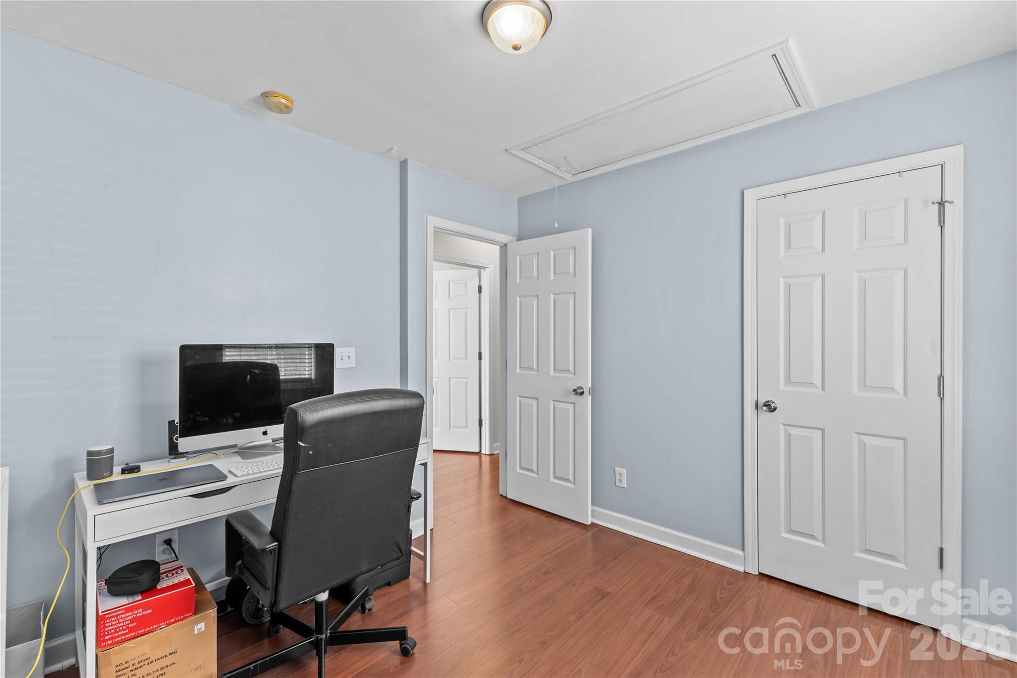 406 Calhoun Street Fort Mill, SC 29715 - Photo 30 of 44 a view of a workspace with furniture and wooden floor