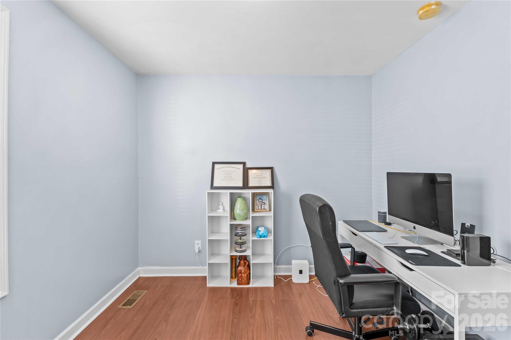 406 Calhoun Street Fort Mill, SC 29715 - Photo 32 of 44 a view of a workspace with furniture and wooden floor