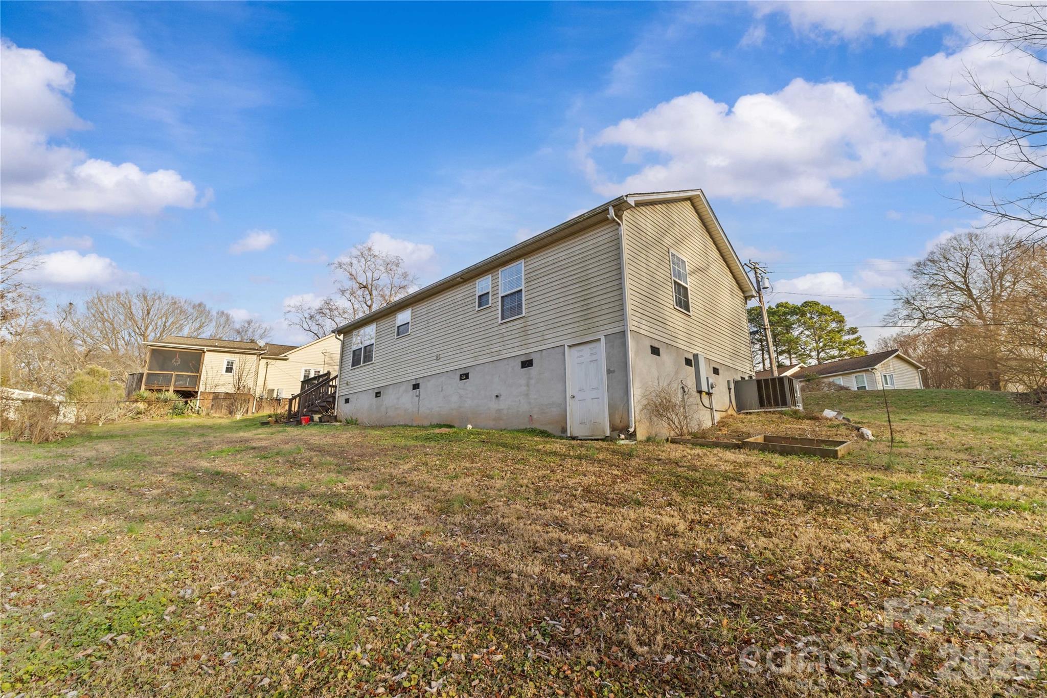 406 Calhoun Street Fort Mill, SC 29715 - Photo 40 of 44 a big house with a big yard and large trees