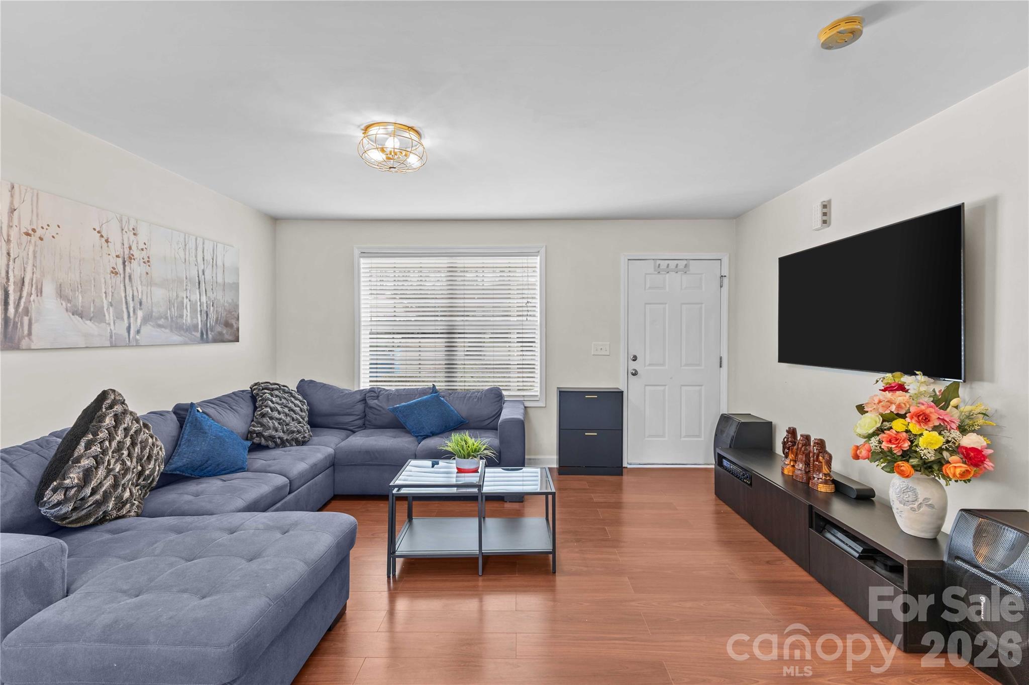 406 Calhoun Street Fort Mill, SC 29715 - Photo 7 of 44 a living room with furniture and a flat screen tv