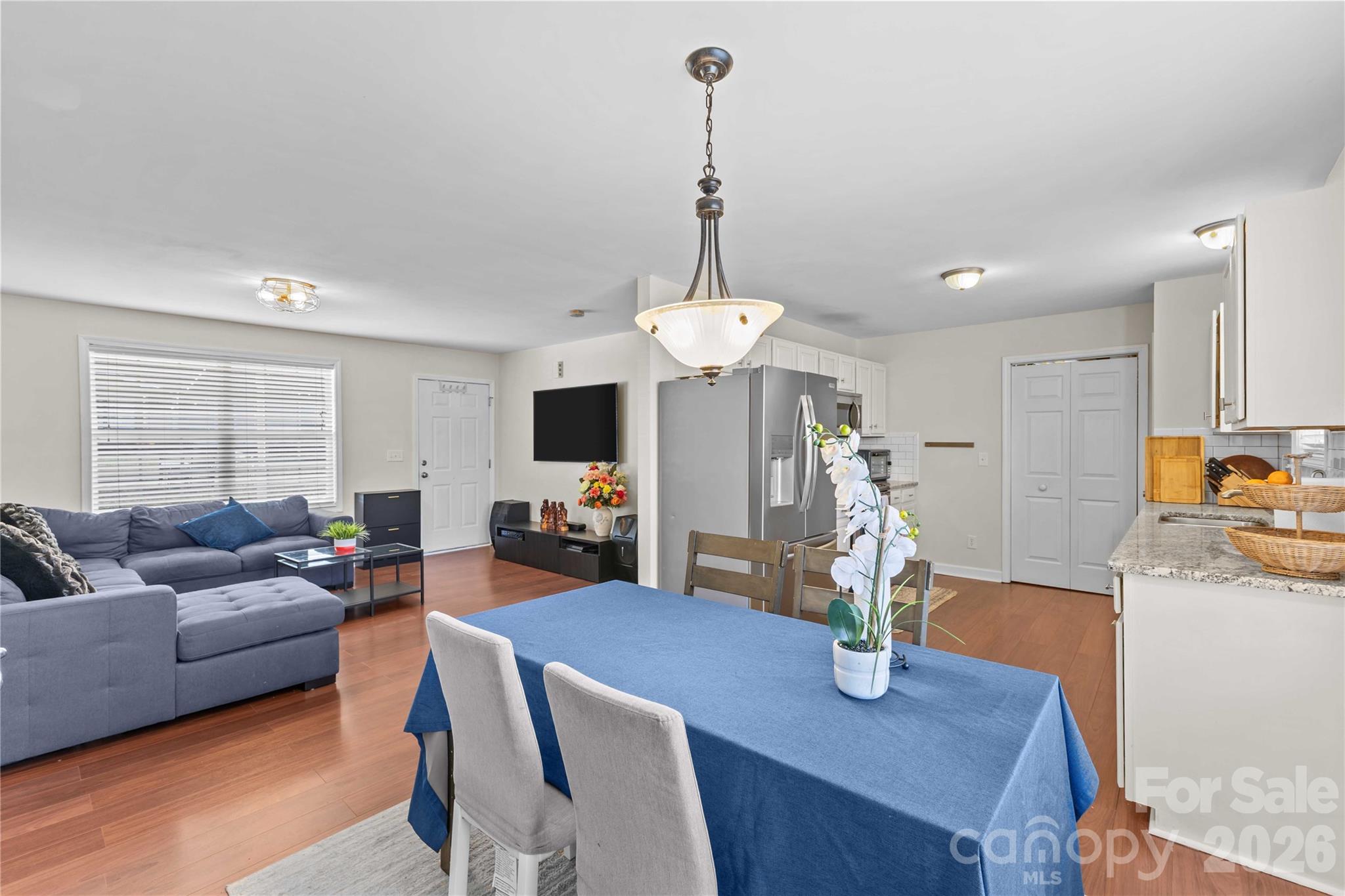 406 Calhoun Street Fort Mill, SC 29715 - Photo 8 of 44 a living room with furniture a flat screen tv and a window