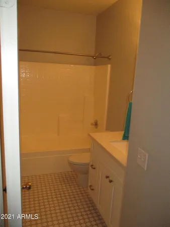 a view of a bathroom with a tub and shower