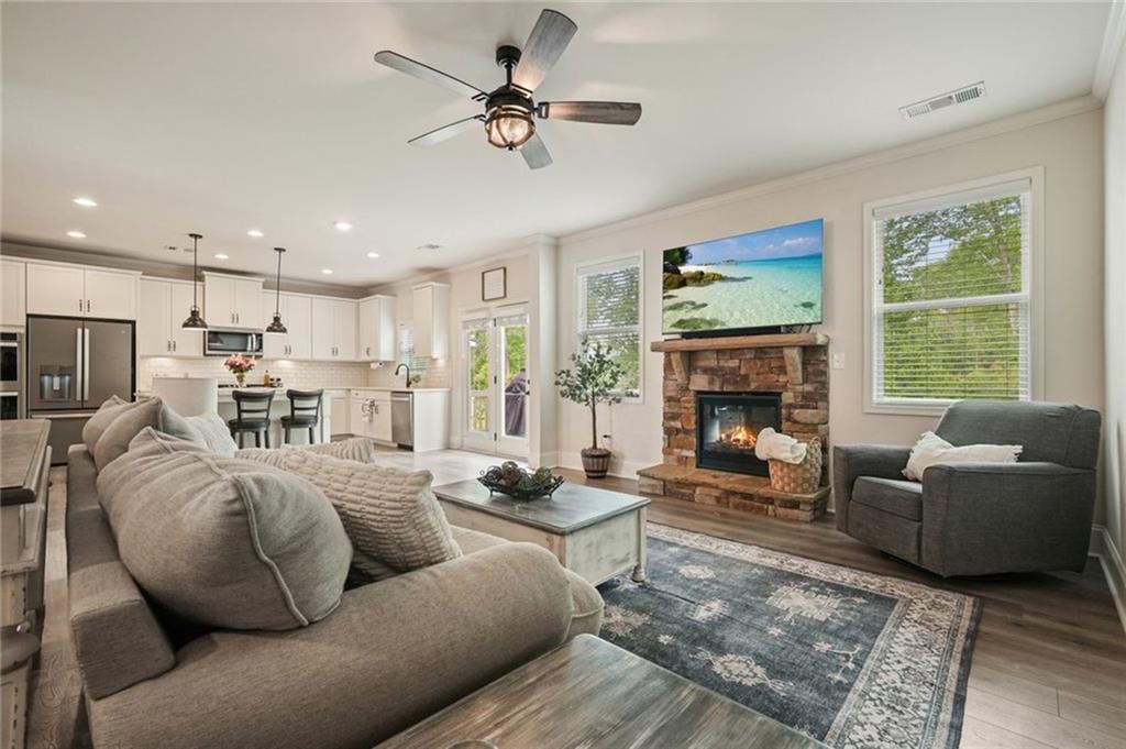 6915 Rambling Vale Dawsonville, GA 30534 - Photo 12 of 63 a living room with furniture and a fireplace