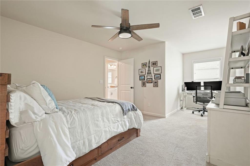 6915 Rambling Vale Dawsonville, GA 30534 - Photo 26 of 63 a bedroom with a bed furniture and window