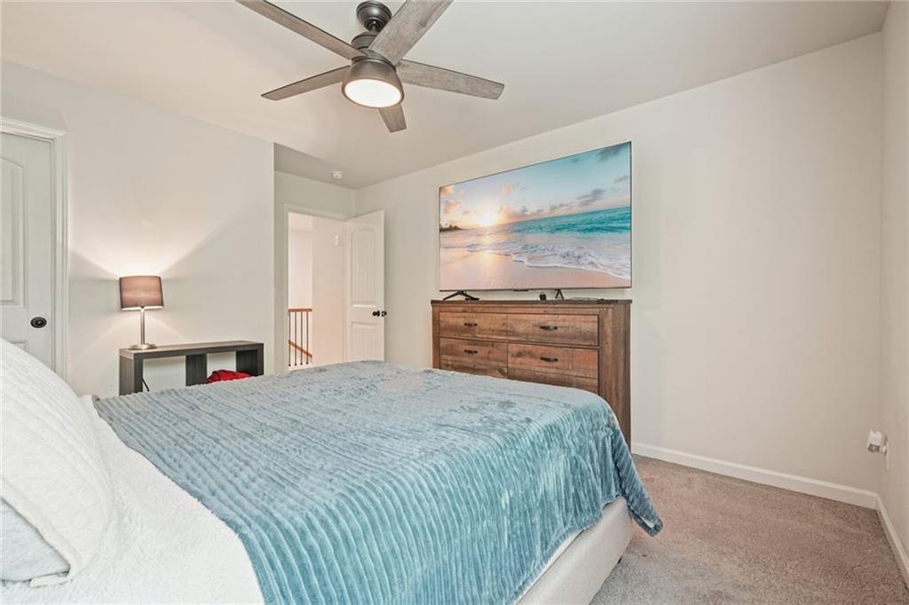 6915 Rambling Vale Dawsonville, GA 30534 - Photo 30 of 63 a bedroom with a bed and a dresser