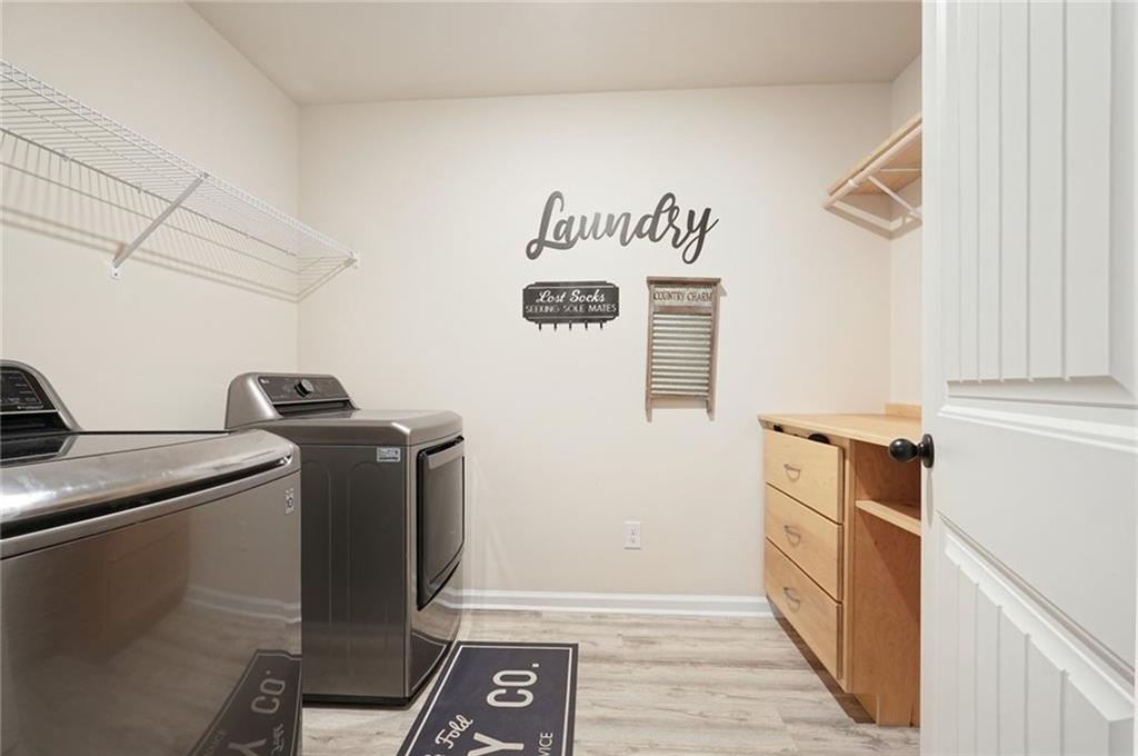 6915 Rambling Vale Dawsonville, GA 30534 - Photo 33 of 63 a utility room with dryer and washer