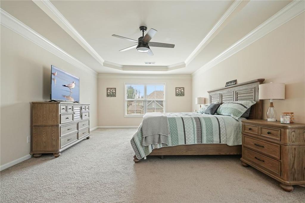 6915 Rambling Vale Dawsonville, GA 30534 - Photo 36 of 63 a bedroom with a bed and a cabinets