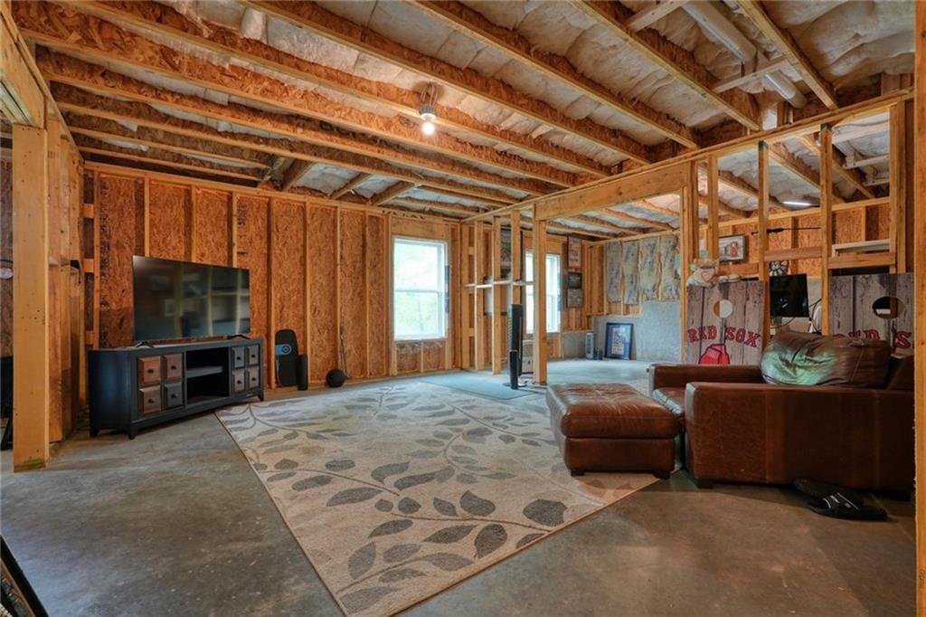 6915 Rambling Vale Dawsonville, GA 30534 - Photo 46 of 63 a bedroom with furniture and large windows