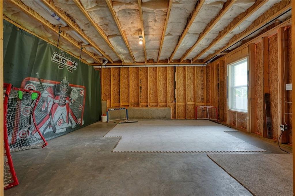 6915 Rambling Vale Dawsonville, GA 30534 - Photo 47 of 63 a view of a room with gym equipment
