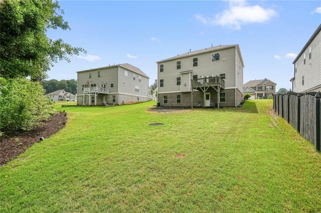 6915 Rambling Vale Dawsonville, GA 30534 - Photo 51 of 63 a view of a house with yard and porch