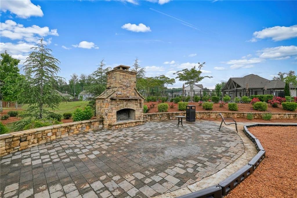 6915 Rambling Vale Dawsonville, GA 30534 - Photo 59 of 63 a view of a swimming pool with a patio and a garden