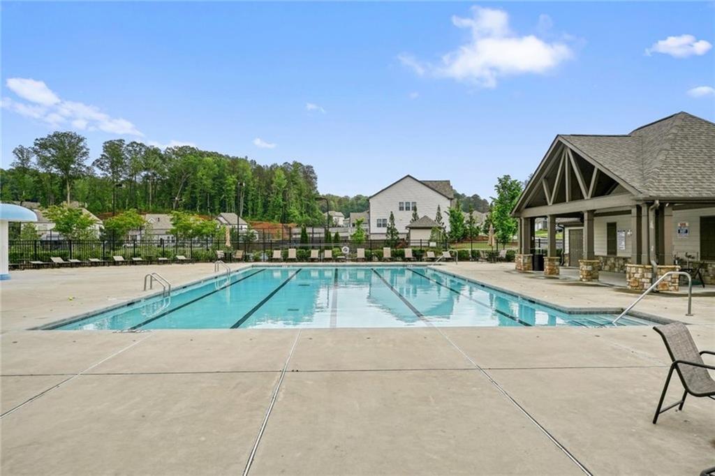 6915 Rambling Vale Dawsonville, GA 30534 - Photo 60 of 63 a view of a house with swimming pool and sitting area