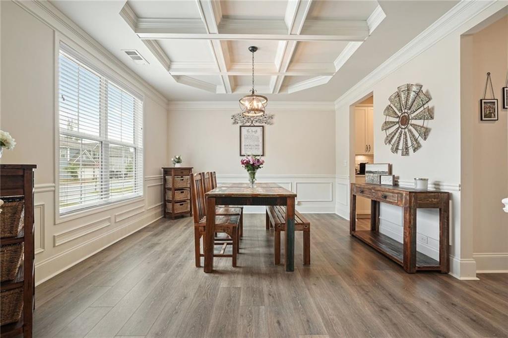 6915 Rambling Vale Dawsonville, GA 30534 - Photo 6 of 63 a view of a dining room with furniture window and wooden floor