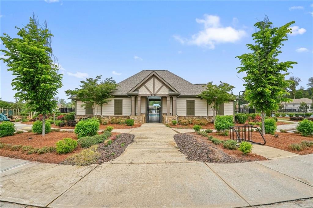 6915 Rambling Vale Dawsonville, GA 30534 - Photo 62 of 63 a front view of a house with garden