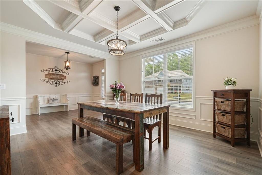 6915 Rambling Vale Dawsonville, GA 30534 - Photo 7 of 63 a view of a dining room with furniture window and wooden floor