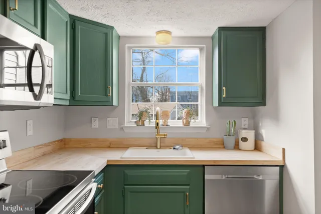 a kitchen with a sink and a window