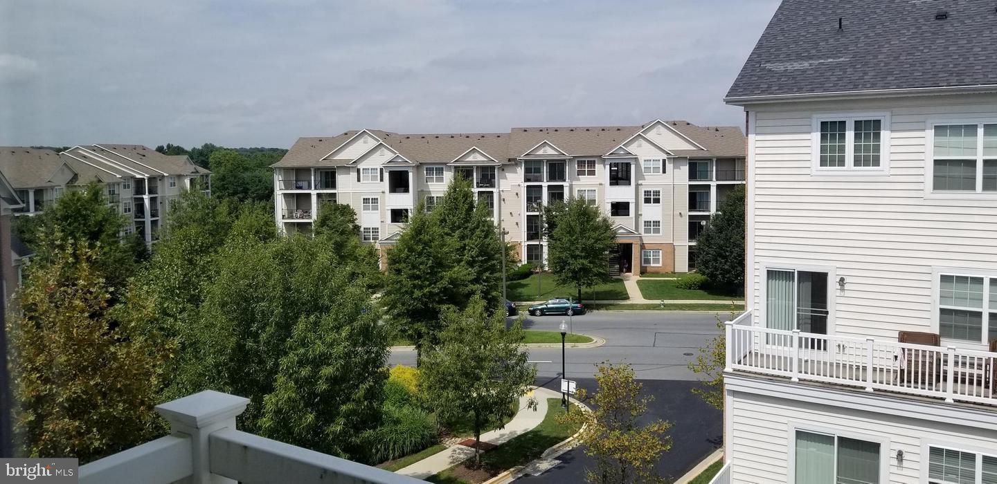 13595 Station Street Germantown, MD 20874 - Photo 7 of 7 a view of multiple houses with a yard