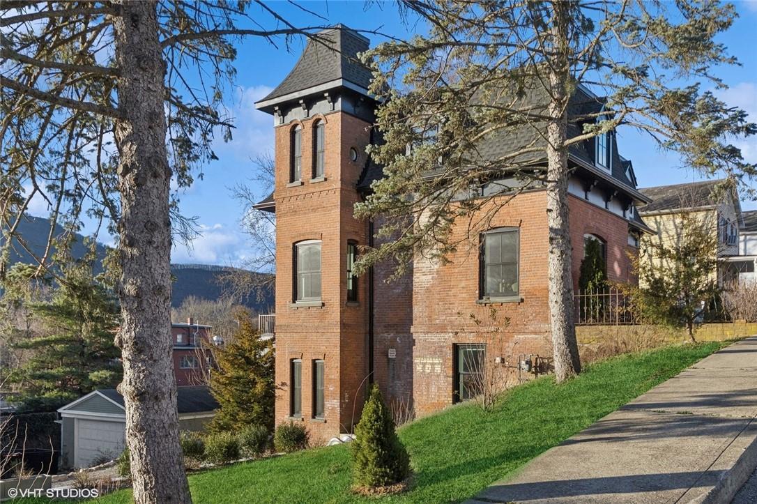 33 Davis Street Beacon, NY 12508 - Photo 1 of 1 front view of house with a yard and trees