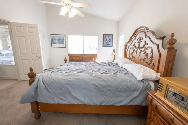 a bedroom with a bed and a window