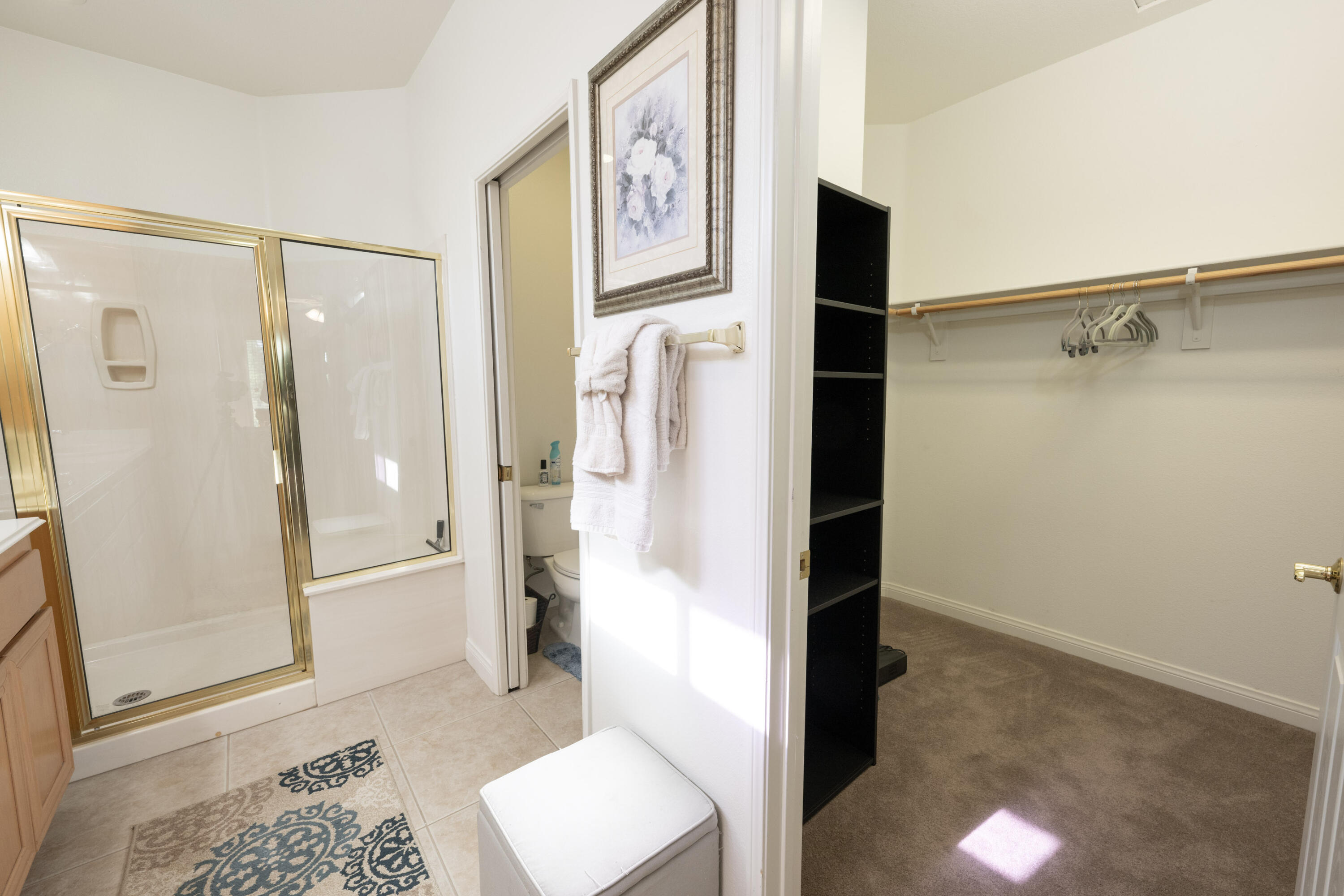 45138 Banff Springs Street Indio, CA 92201 - Photo 14 of 38 a bathroom with a bathtub and a shower