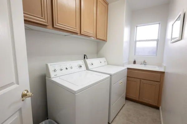 a utility room with dryer and washer