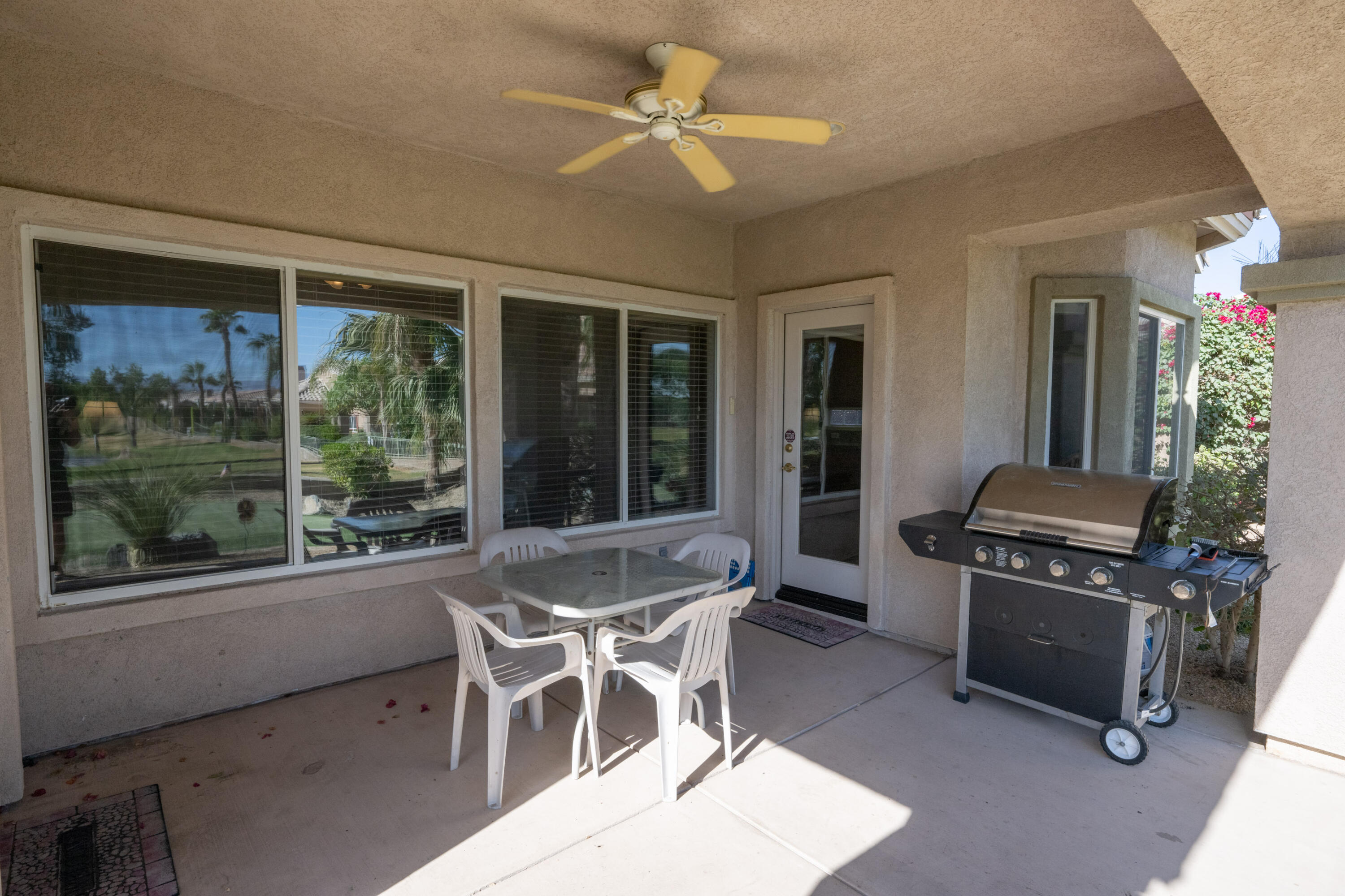 45138 Banff Springs Street Indio, CA 92201 - Photo 19 of 38 a dining room with furniture and window